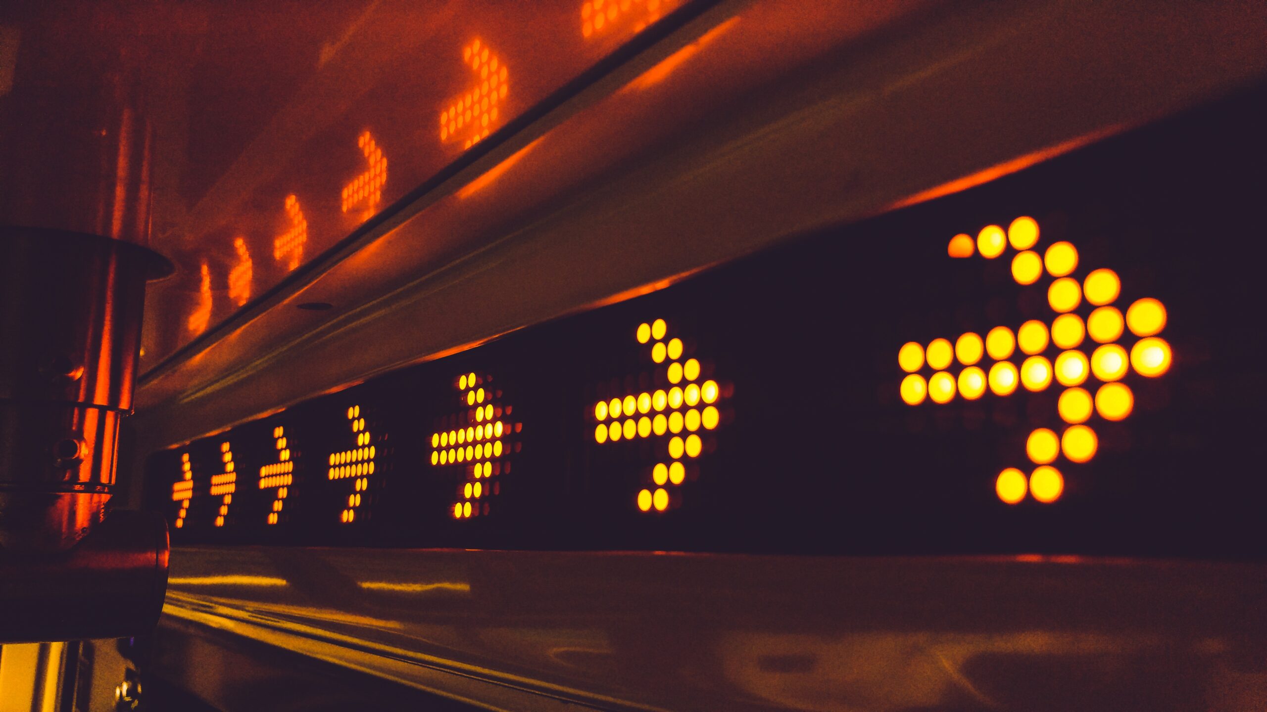 Photo of an LED arrow board with 6 visible arrows pointing to the right.